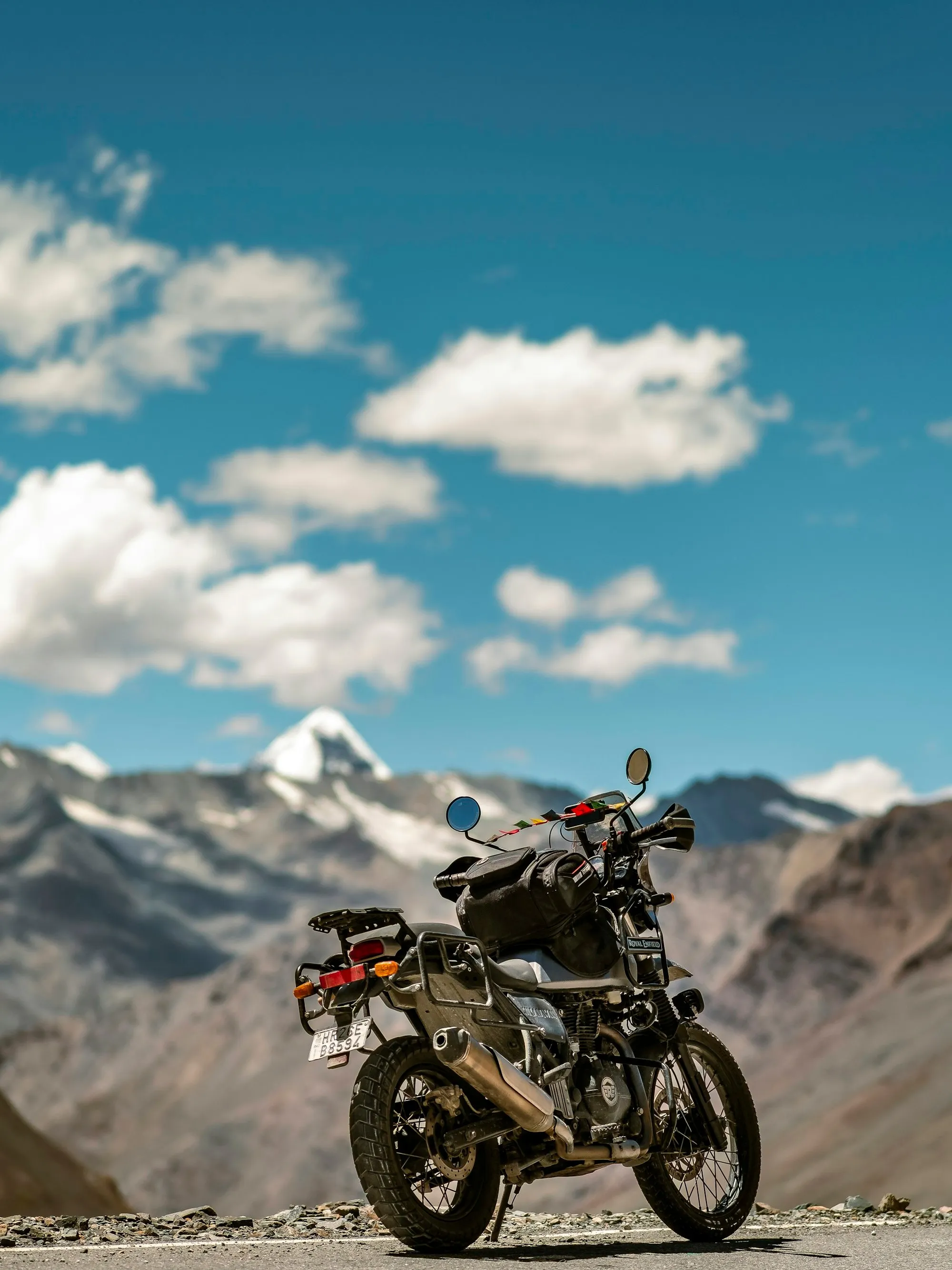Royal Enfield motorcycle parked on a mountain road in Ladakh